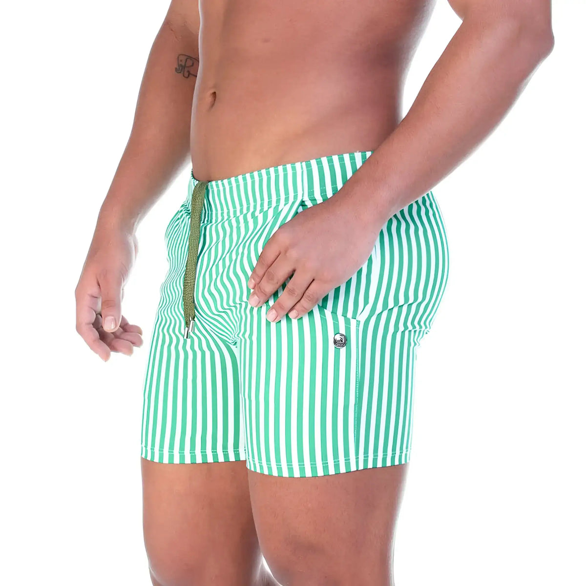 Green and white vertically striped swim trunks with drawstring waistband from gigo polo green beachwear collection