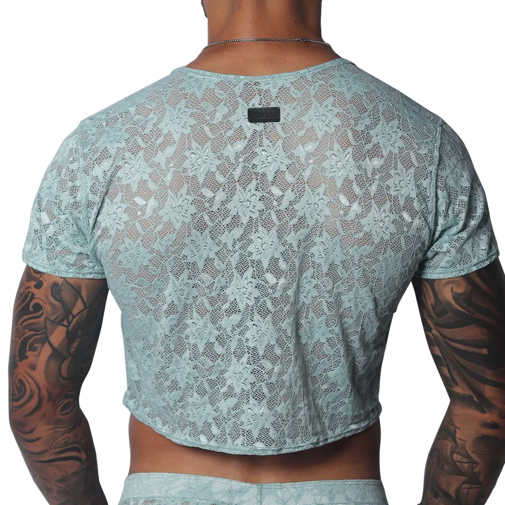 Aqua floral lace crop top with short sleeves and a small black brand tag at the back neckline.