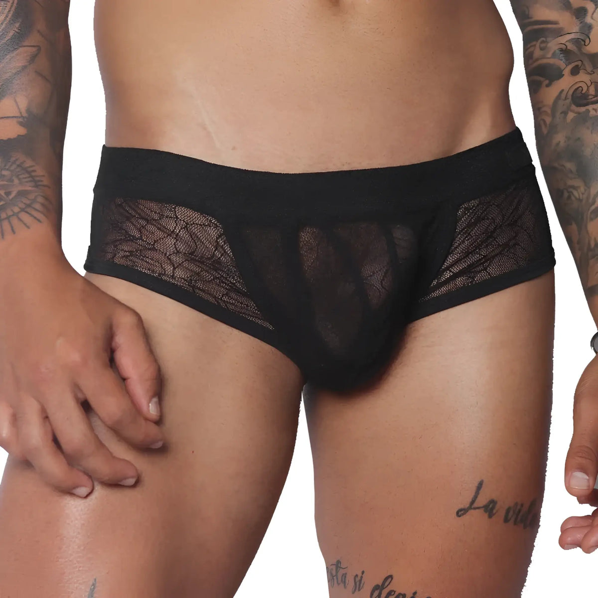 Black men's trunk underwear featuring a sheer, delicate floral lace pattern, a solid waistband, and solid front panel.