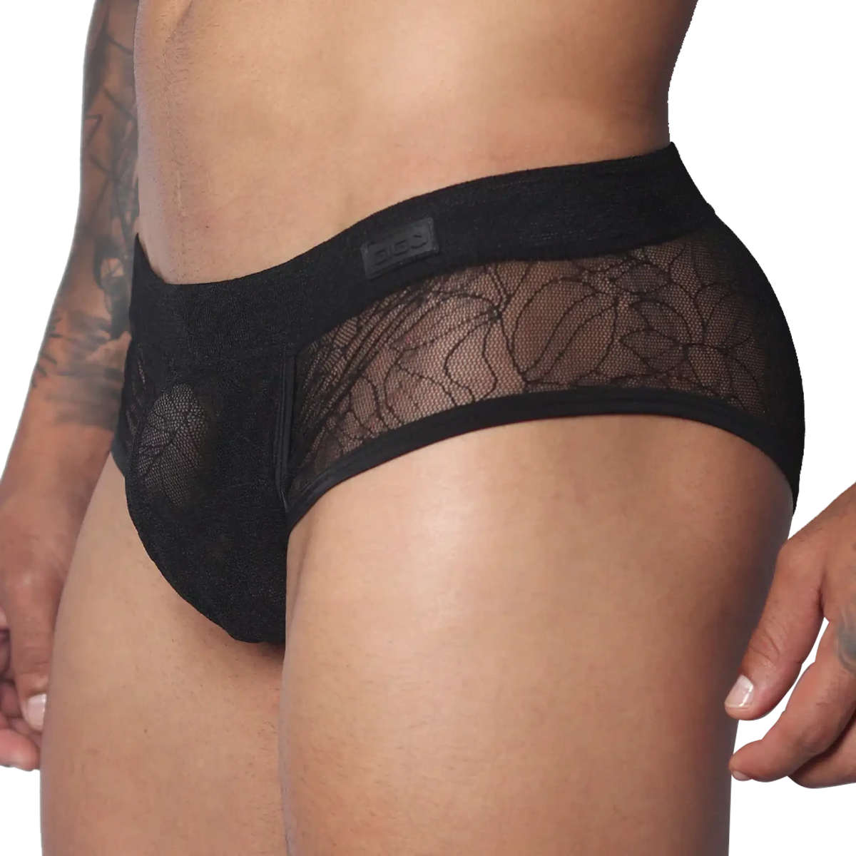 Black men's trunk with floral lace panels, solid waistband featuring a Gigo logo patch, and a contoured pouch design.