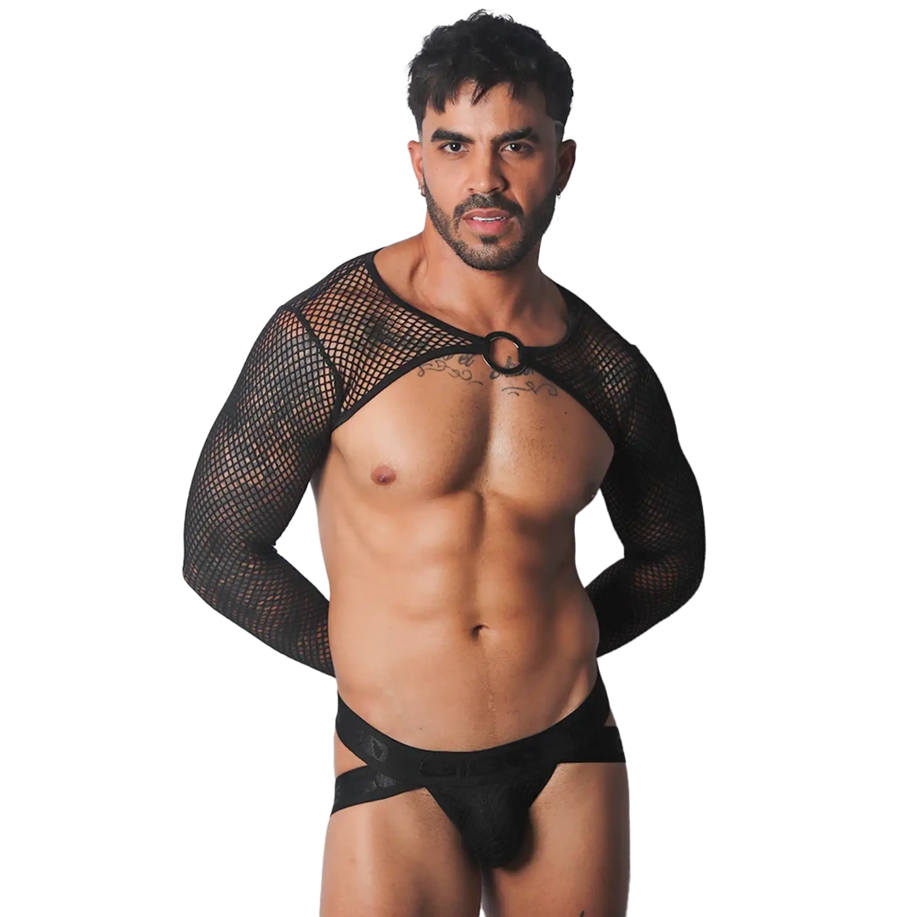 Black mesh bolero harness with long sleeves and a center O-ring, worn over a branded elastic jockstrap.