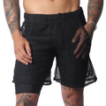 Black athletic shorts with an elastic waistband, featuring a sheer, oversized mesh outer layer over solid lining.
