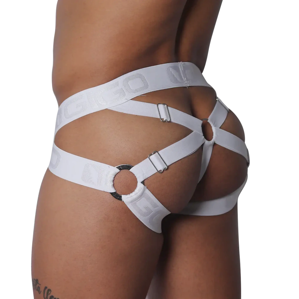 White elastic jockstrap featuring a strappy cage design with metal rings, adjustable buckles, and logo-embossed bands.