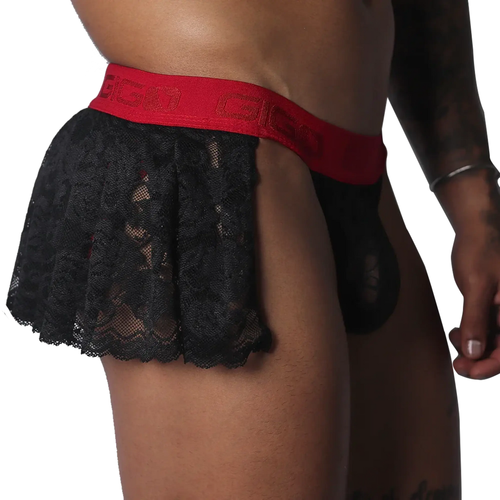 Black lace mini skirt with a red elastic waistband featuring the GIGO logo, worn over matching black lace briefs.