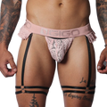 Romantic pink lace Gigo jockstrap with frilled edges, branded elastic waistband, and black adjustable leg garters.