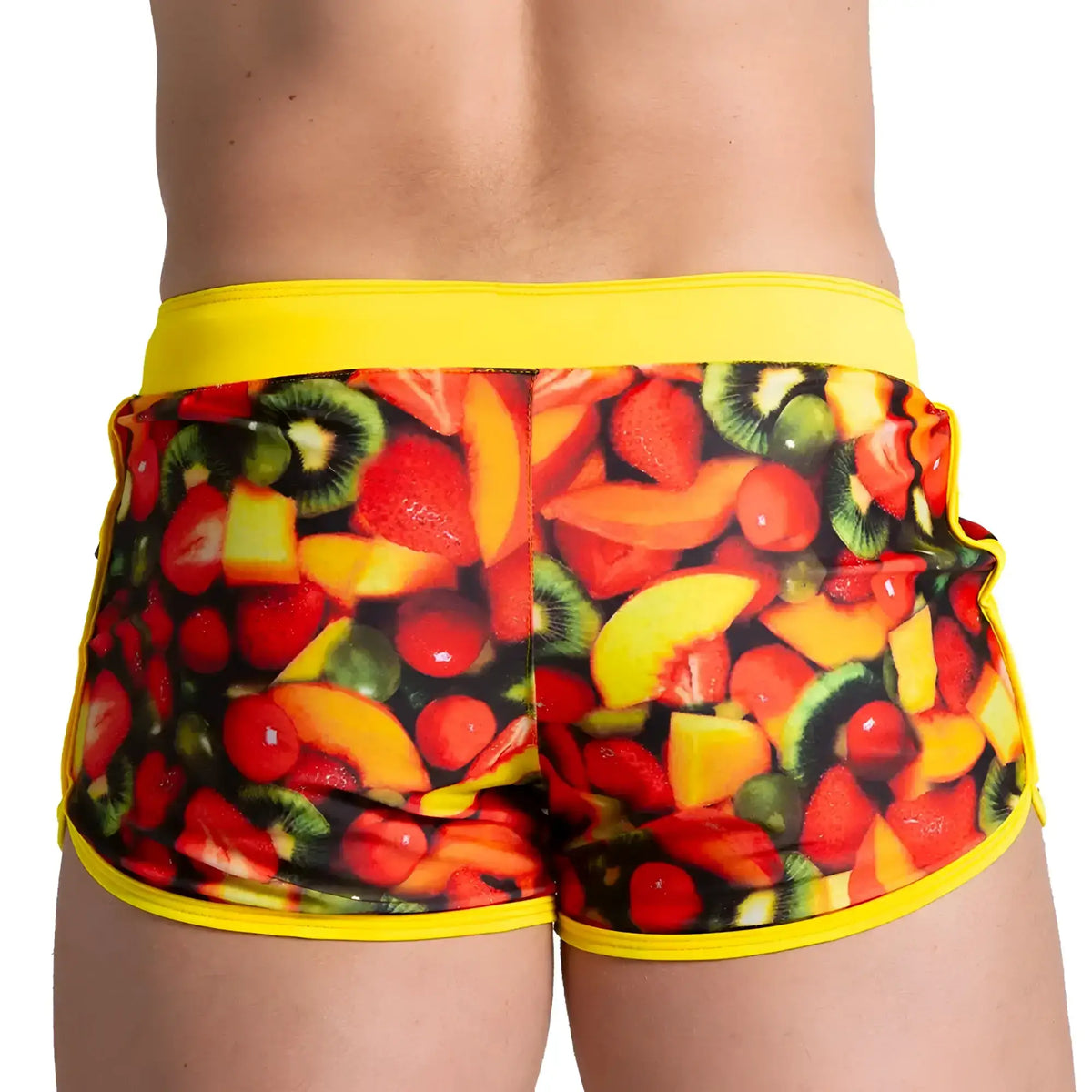Vibrant fruit-print gigo salad beachwear swim trunks with bold yellow waistband and trim for casual beach use