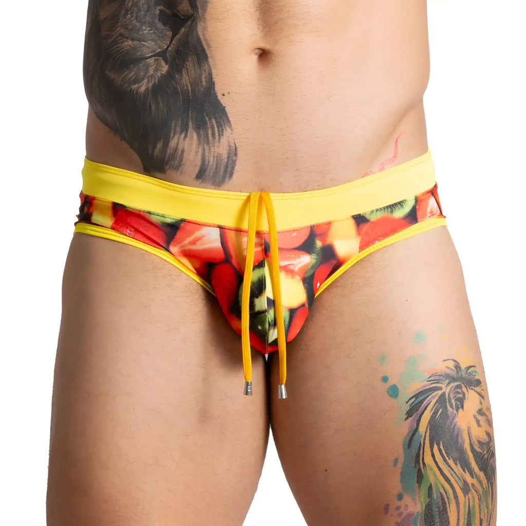Bright yellow gigo salad swim brief swim trunks with colourful sliced strawberries and kiwi print for summer use