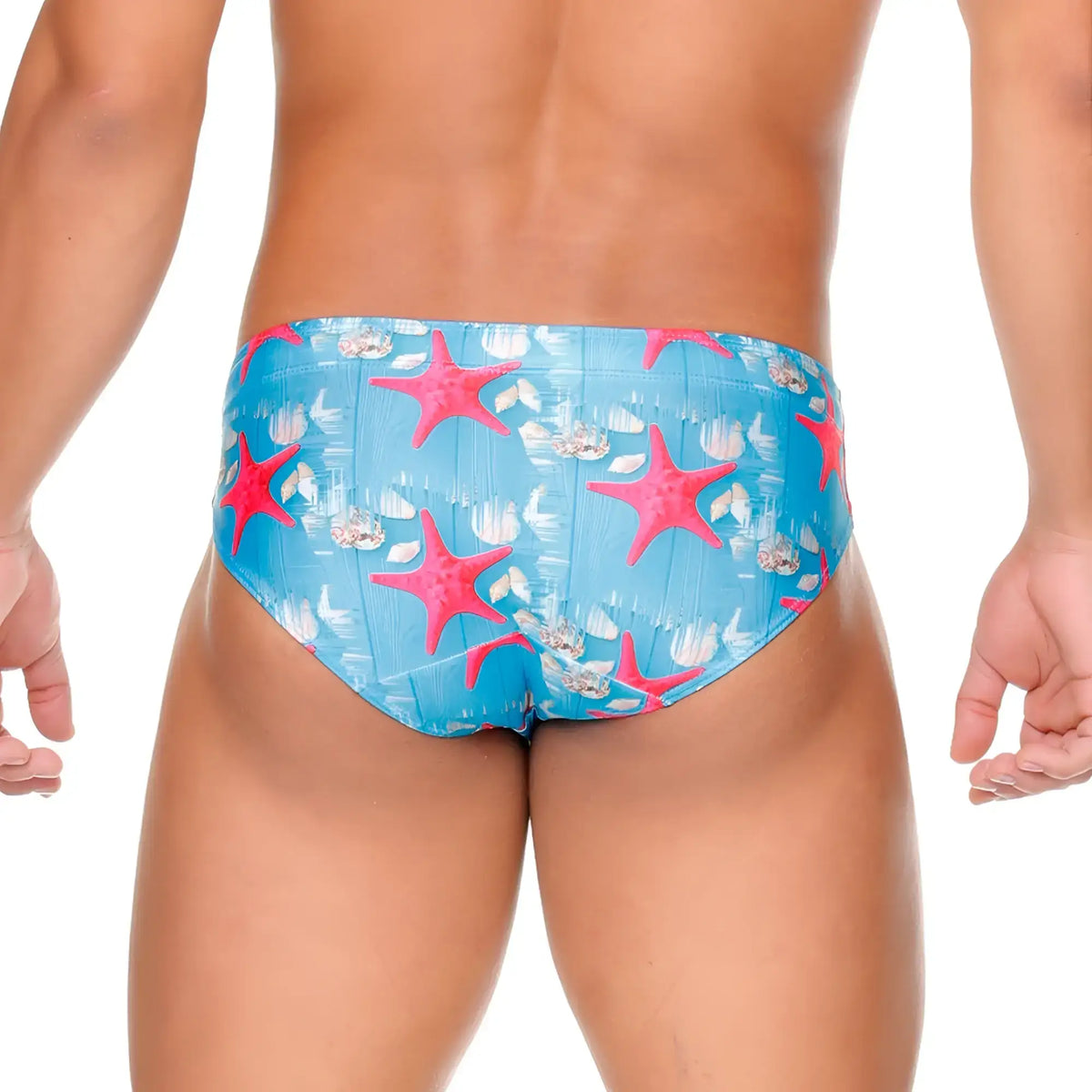 Gigo sea swim brief featuring bright pink starfish and white seashell patterns on vibrant blue swim trunks material