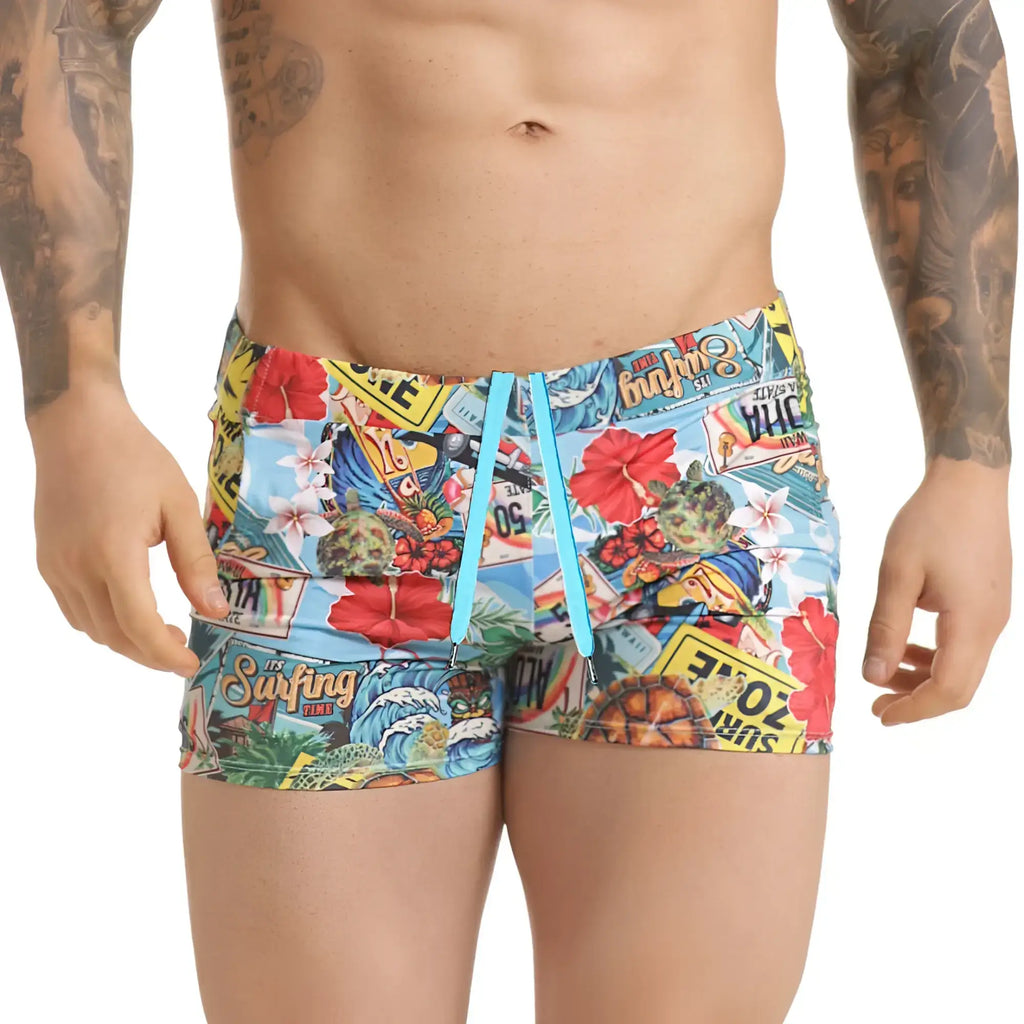 Vibrant gigo seventies beachwear swim trunks with colourful surfboards flowers and license plates in blue red yellow and green