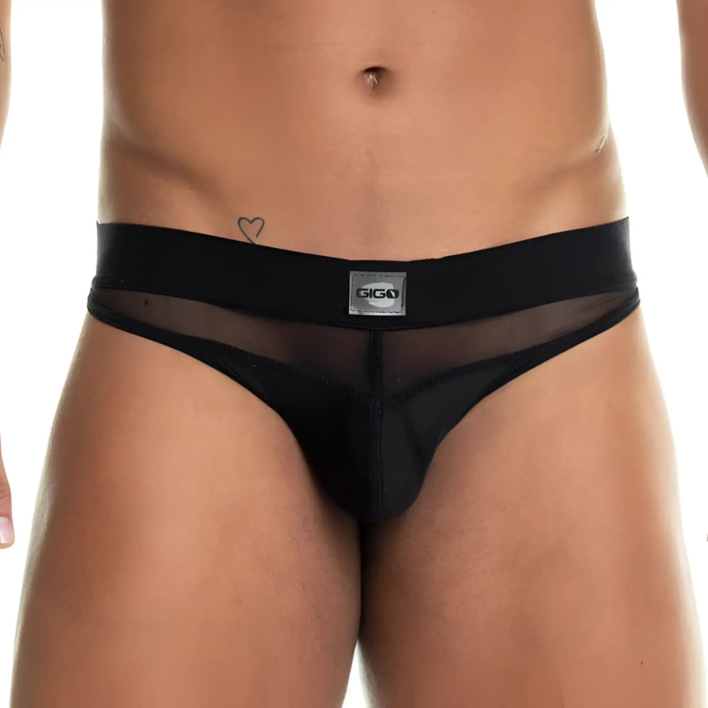 Black sheer thong brief with solid waistband and silver gigi brand label from gigo skin black brief collection