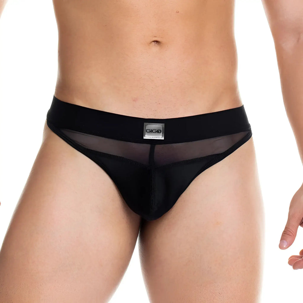 Black giga brand thong with sheer mesh front panel and solid fabric sides from gigo skin black gstring collection