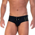 Gigo Soccer black swim brief with olive green vertical stripes and silver-toned drawstring hardware for swimming