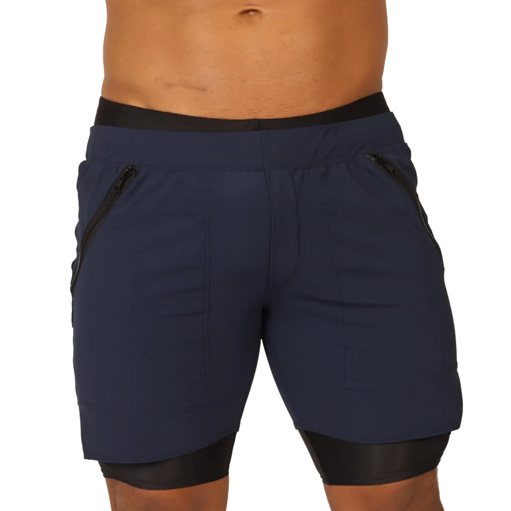 Navy blue gigo sporty blue shorts with black elastic waistband black trim and side zip pockets for athletic use