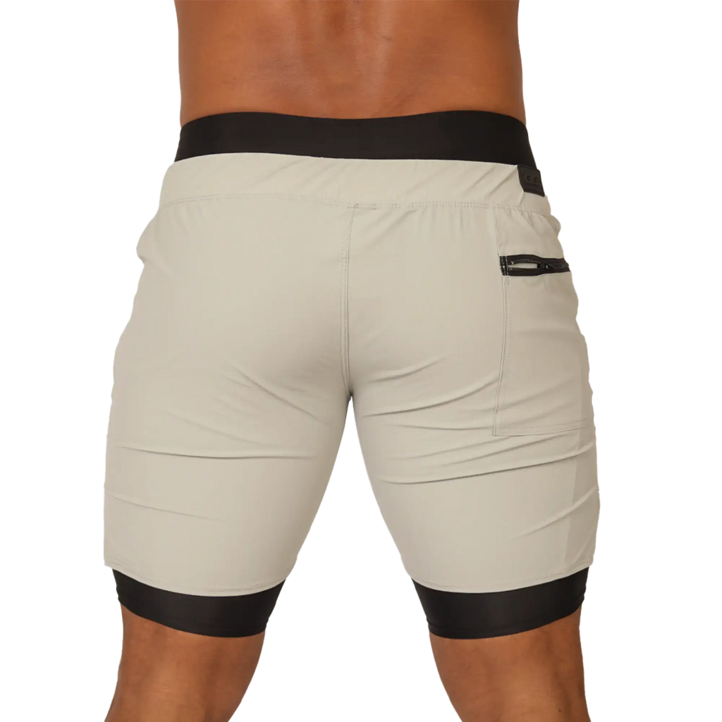 Beige gigo sporty gray short with black elastic waistband and leg cuffs featuring a side zip pocket for activewear
