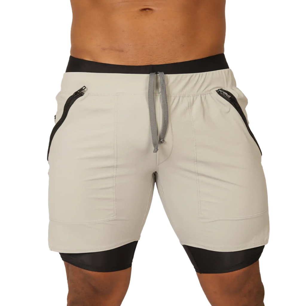 Cream-coloured Gigo sporty gray short with black trim, side zippers, and drawstring waistband for athletic use