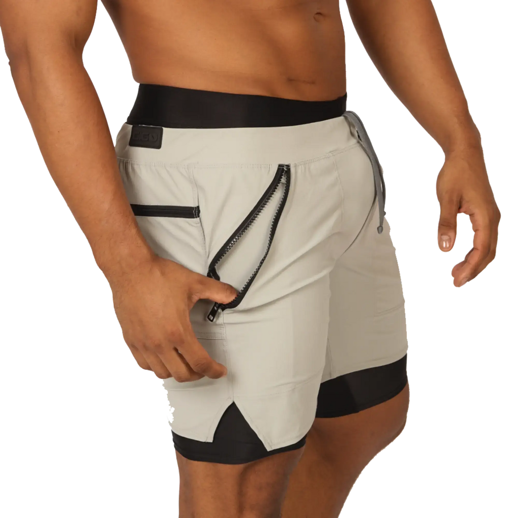 Light gray gigo sporty shorts with black trim and zippered side pocket for athletic use