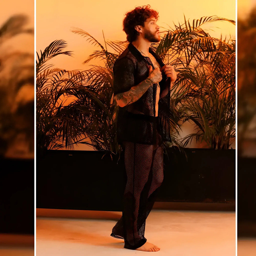 Black mesh gigo striking shirt with subtle pattern and sheer flowing fabric displayed from the front