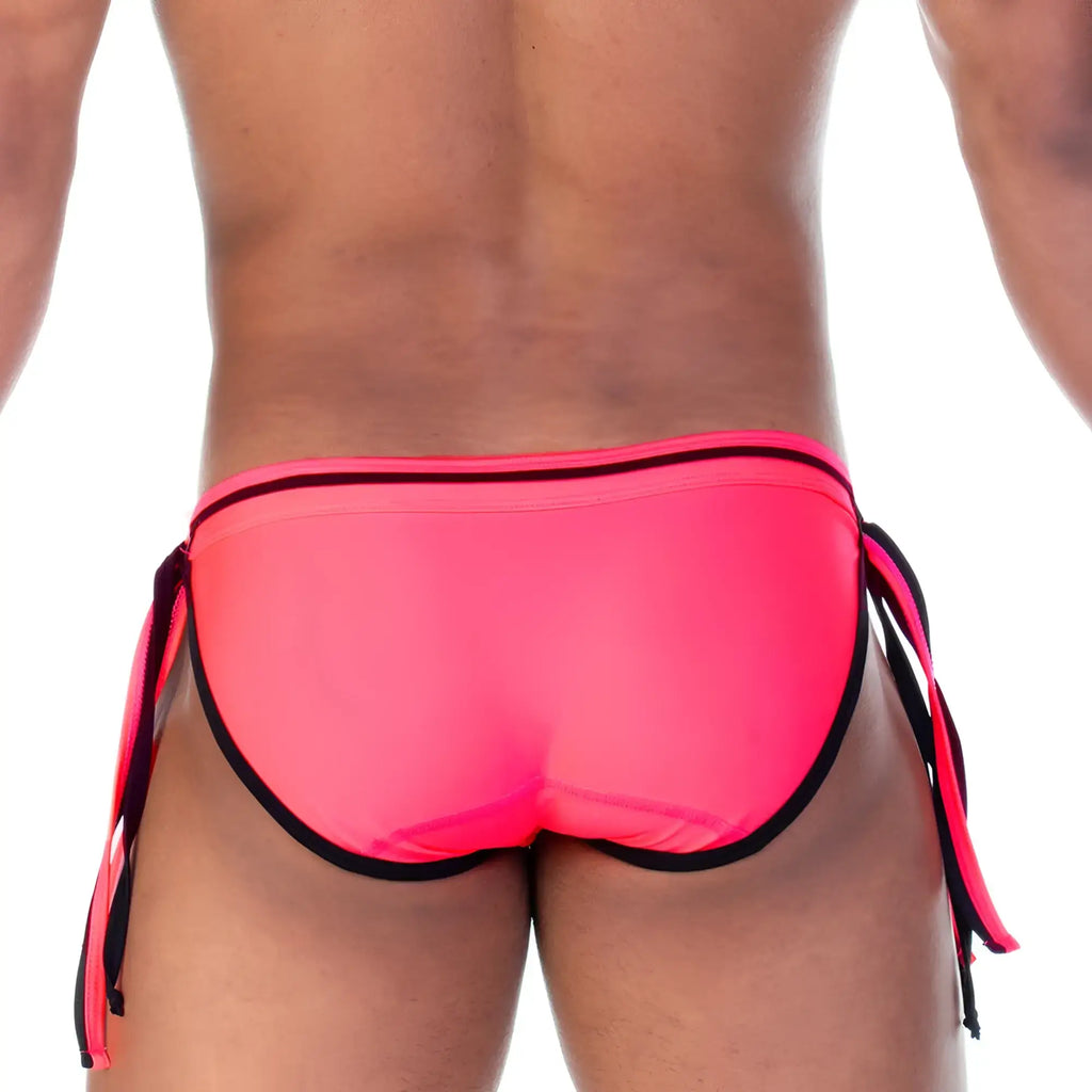 Bright pink gigo strip swim brief with black trim and side ties designed for swimming and beachwear
