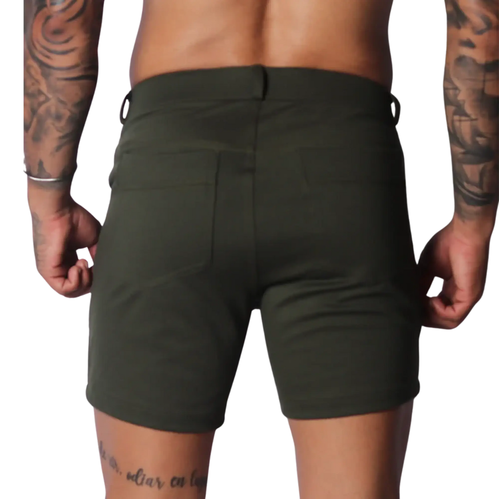 Form-fitting Sunday green short in a smooth, matte fabric with two back pockets and a clean, minimalist design.
