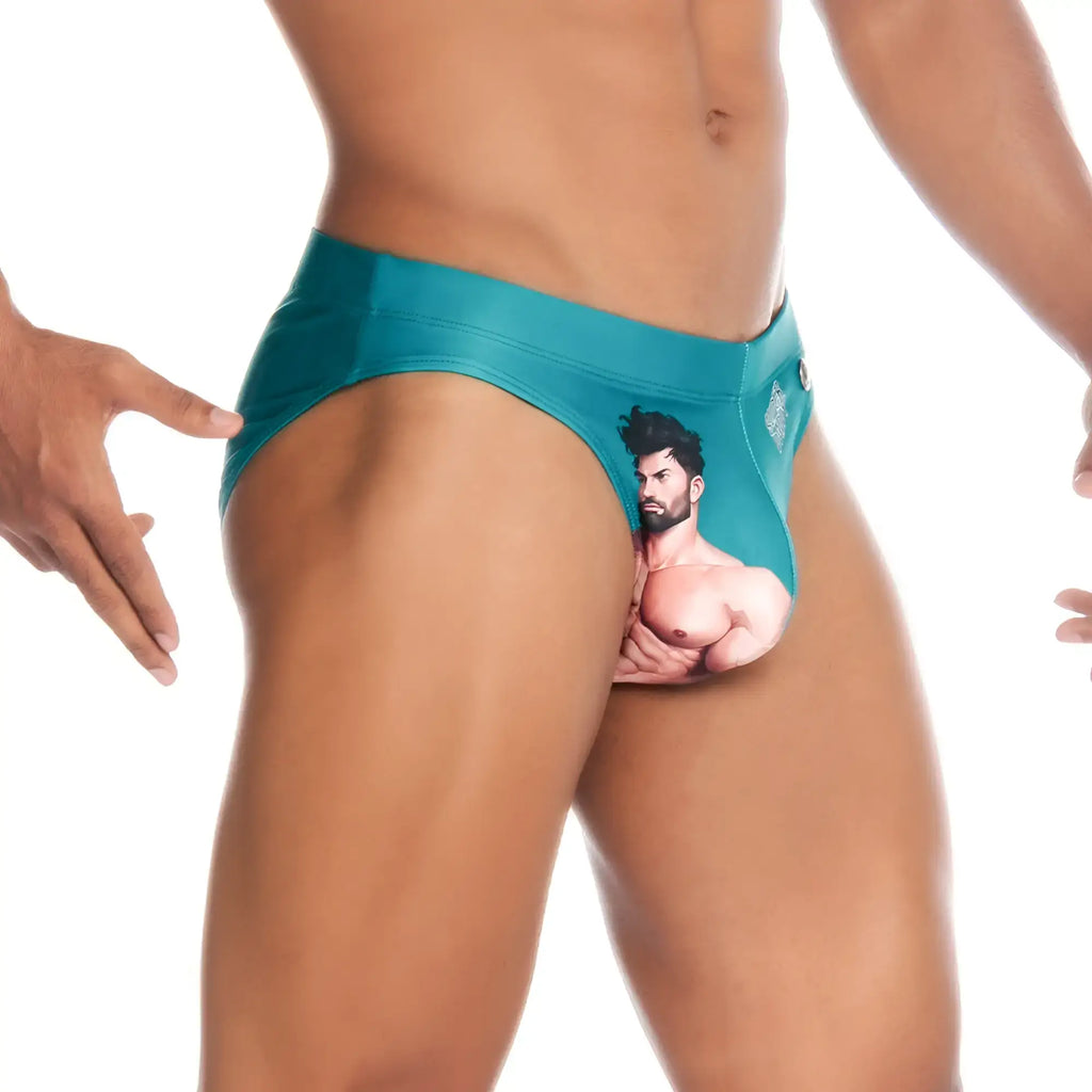Teal menÃ¢â‚¬â„¢s briefs with a printed muscular man graphic from gigo super daddy blue swim brief collection