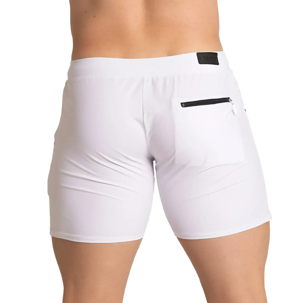 White gigo tennis short featuring black zipper pocket and branded patch on waistband for athletic use