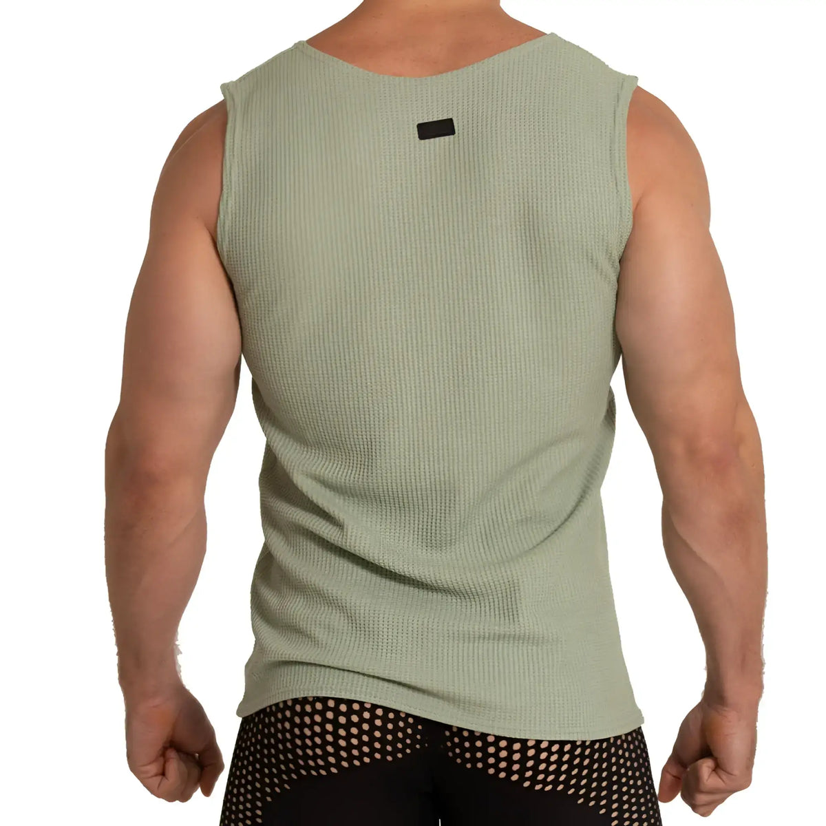MenÃ¢â‚¬â„¢s olive green ribbed sleeveless tank top with black neckline tag called Gigo Tissue Green Tank