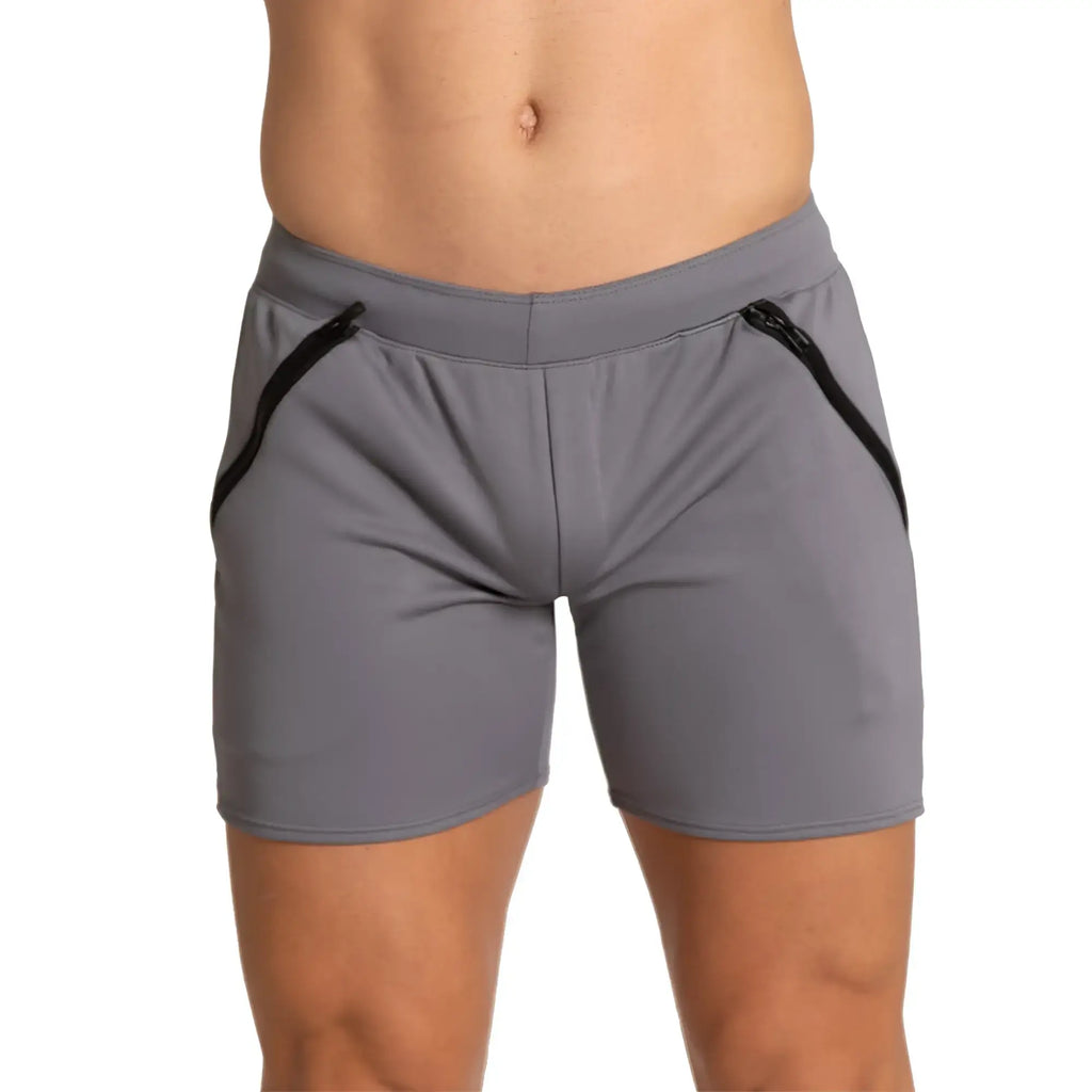 Gray athletic shorts with black zipper accents on the sides designed for training by gigo