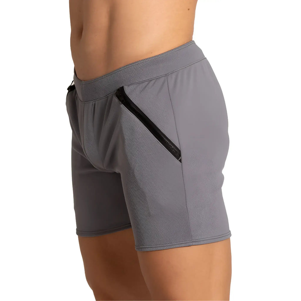 Gigo training gray short made of textured fabric with black zipper pocket on the side for athletic use