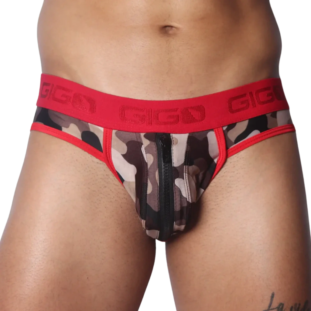 Camo print jockstrap with a front vertical zipper, red trim, and a branded red elastic waistband.