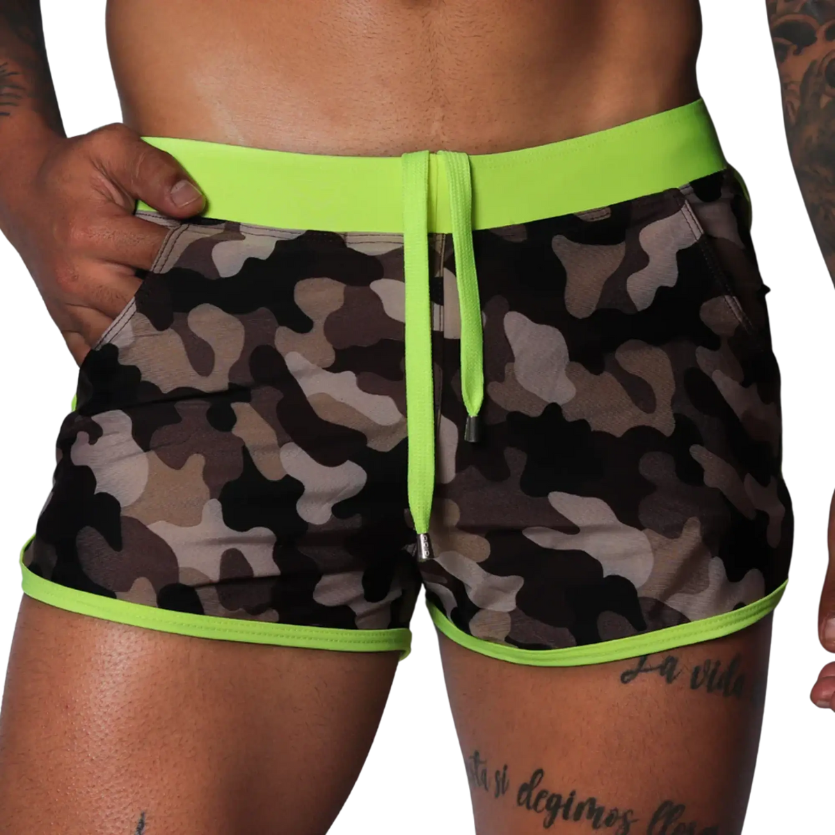 Short camouflage swim trunks with neon yellow elastic waistband, matching drawstring, and neon yellow piped trim.