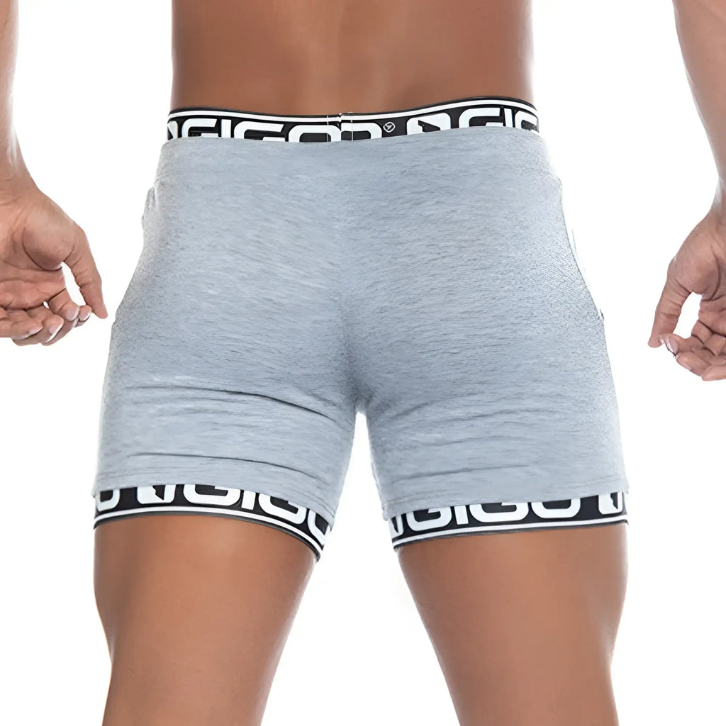 Gray heathered athletic shorts with black and white branded elastic waistband and hem trim gigo tropixx gray short