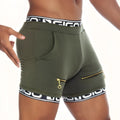 Olive green gigo tropixx athletic shorts with black and white branded waistband, side zippers, and front pocket