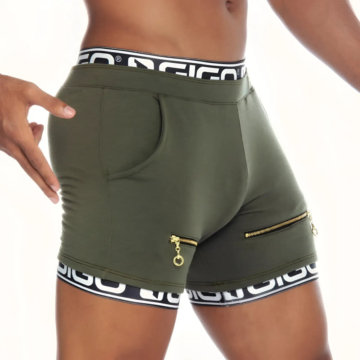 Olive green gigo tropixx athletic shorts with black and white branded waistband, side zippers, and front pocket