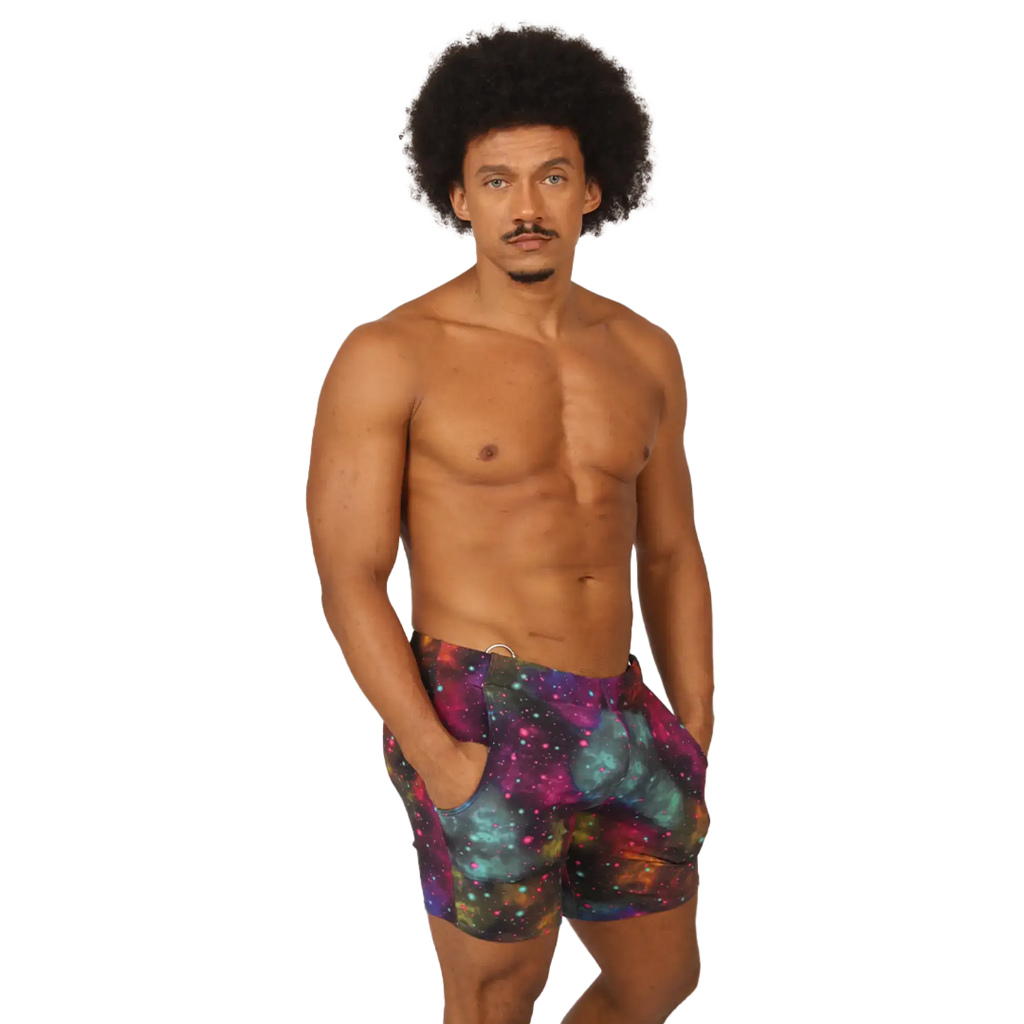 MenÃ¢â‚¬â„¢s galaxy-print swim trunks in purple teal and pink cosmic nebula design from Gigo Universe Beachwear