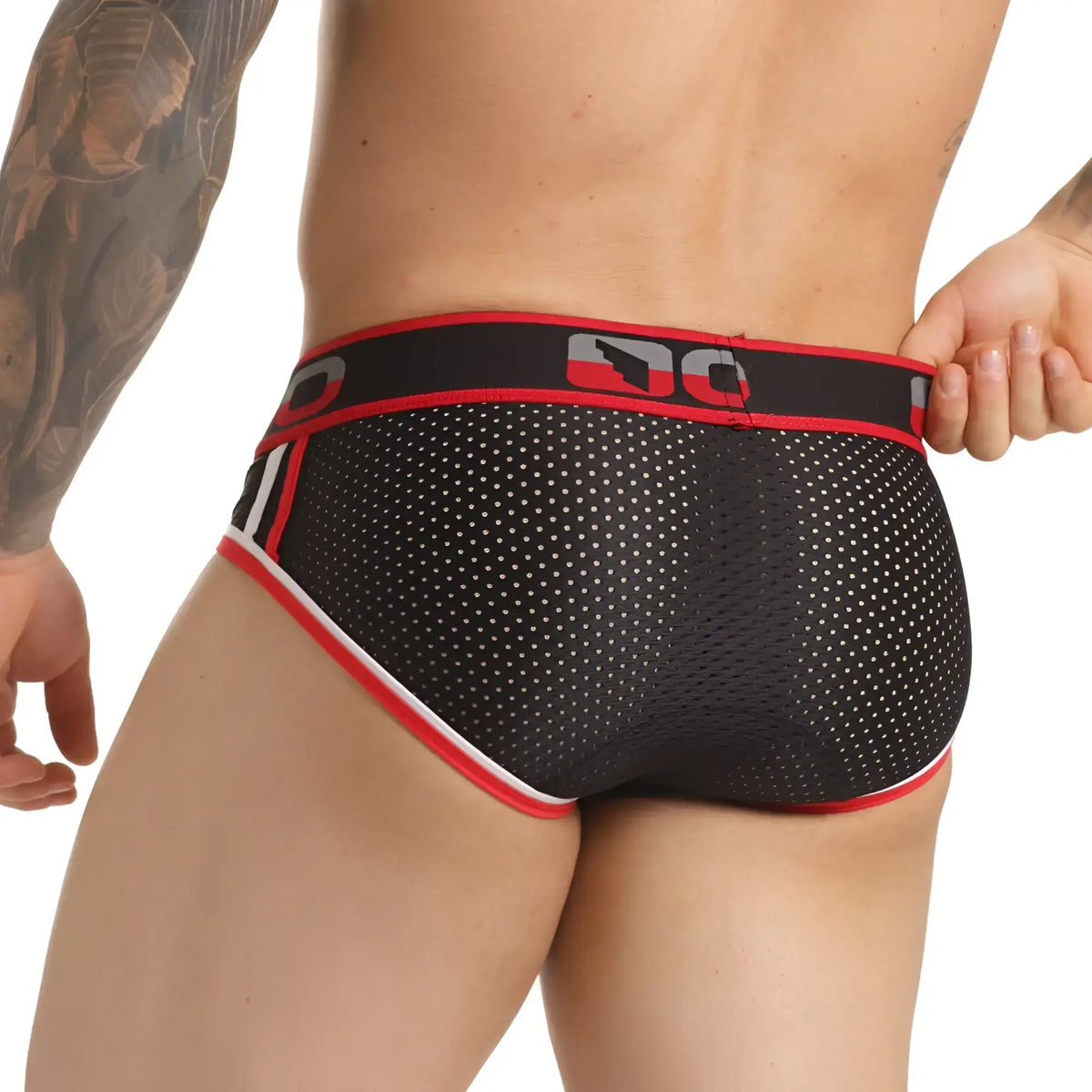 Black mesh briefs with red and white trim and bold dc logo on waistband from gigo versatil red brief collection