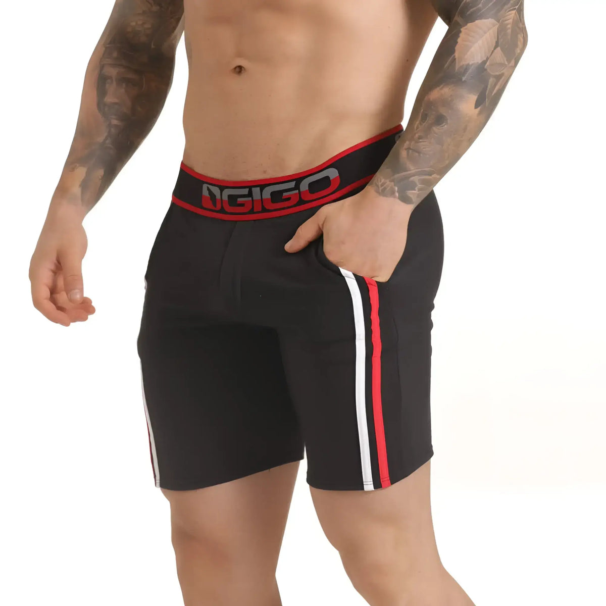 Black gigo versatil red athletic shorts with red and white side stripes designed for versatile sports use