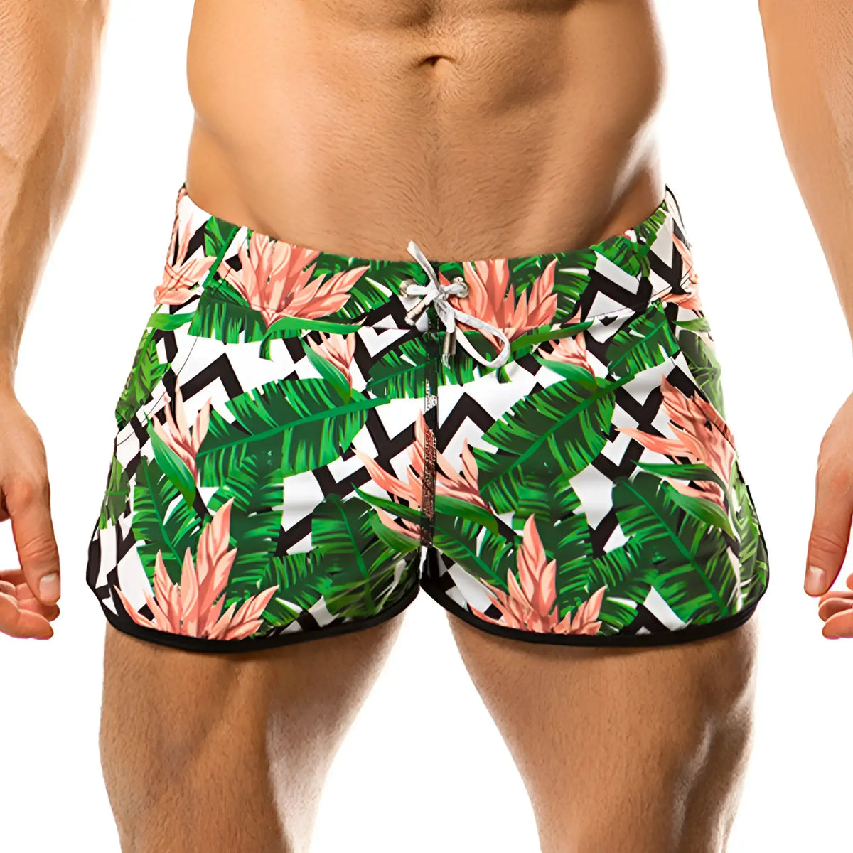 Gigo vintage beachwear swim trunks with tropical leaf and pink flower pattern and black zigzag accents