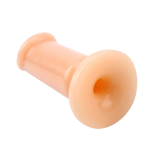 Peach-colored silicone handle of GK Power Cock Plug flesh medium 4.7in with rounded ergonomic design and central grip hole