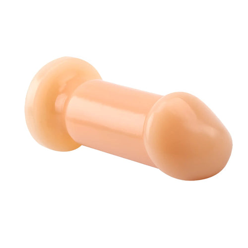Peach-colored silicone anal plug with rounded ends and smooth glossy surface gk power cock plug flesh small 3.5in