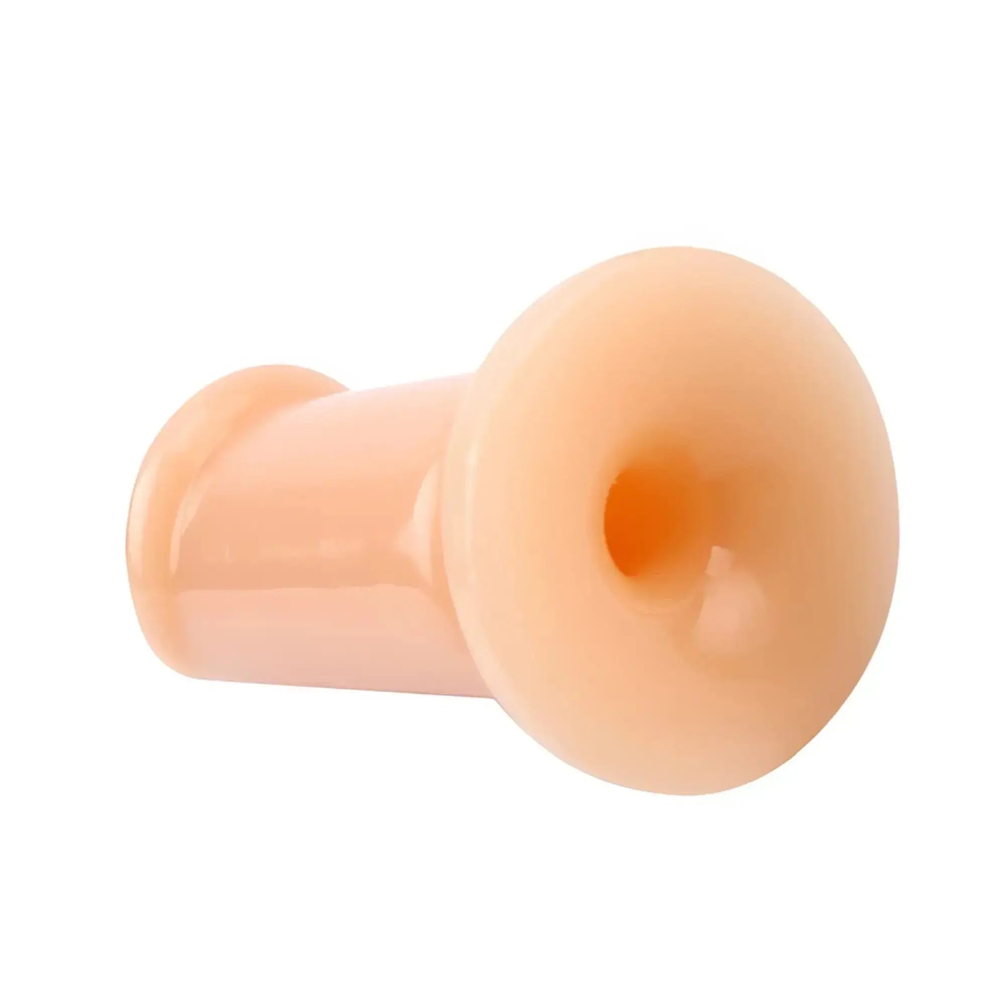 Peach-colored silicone anal plug gk power cock plug flesh small 3.5in with rounded flared head and smooth glossy finish