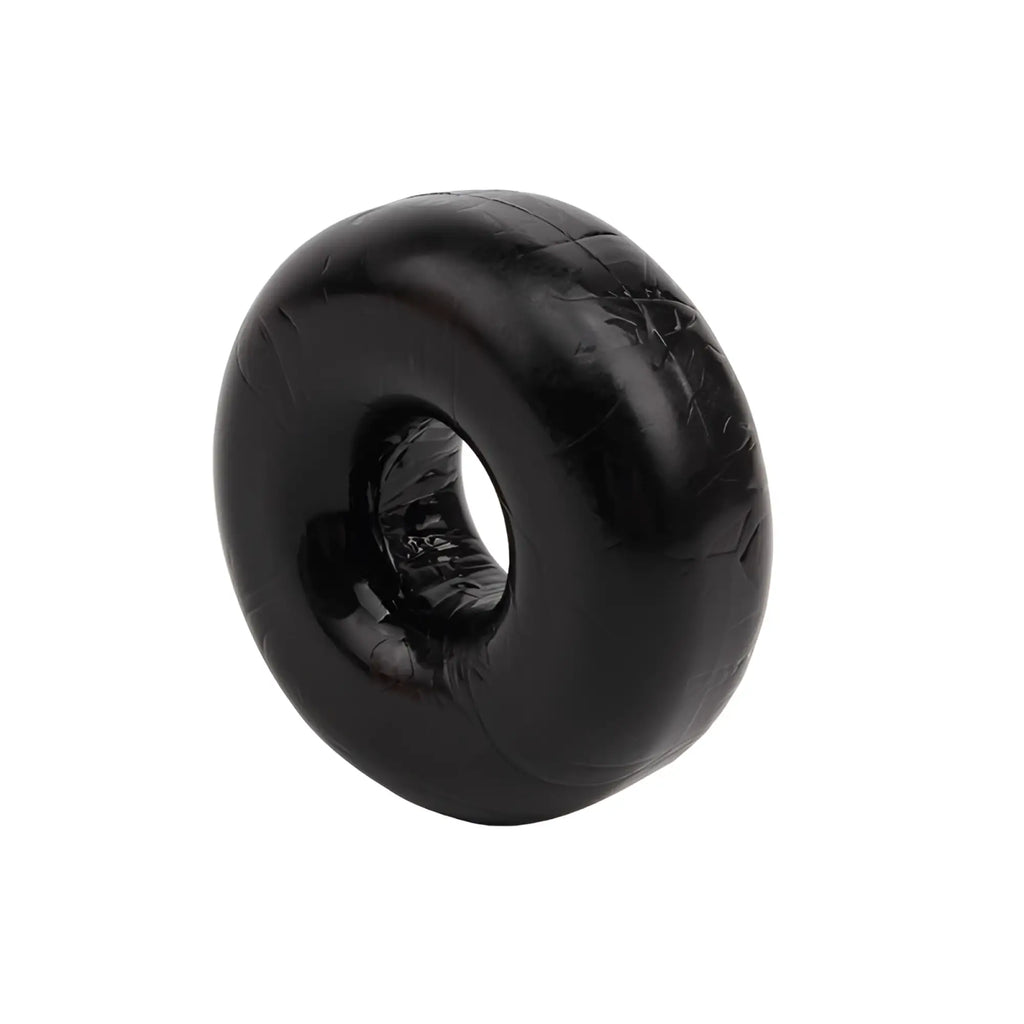 Black rubber donut-shaped gk power fat o cock ring with glossy finish and visible texture one size fits all