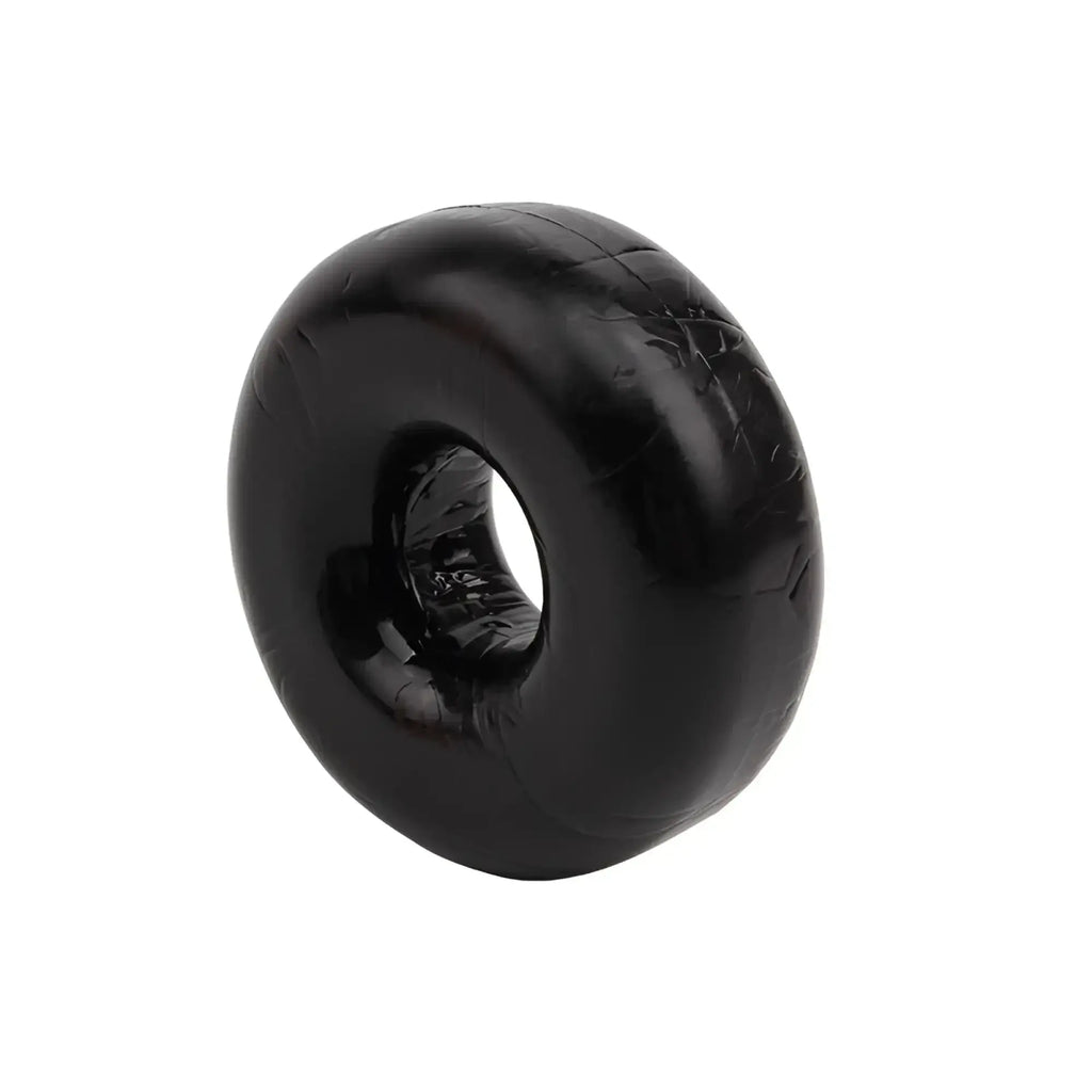 Black rubber donut-shaped cock ring with glossy textured finish from gk power mega fat o one size