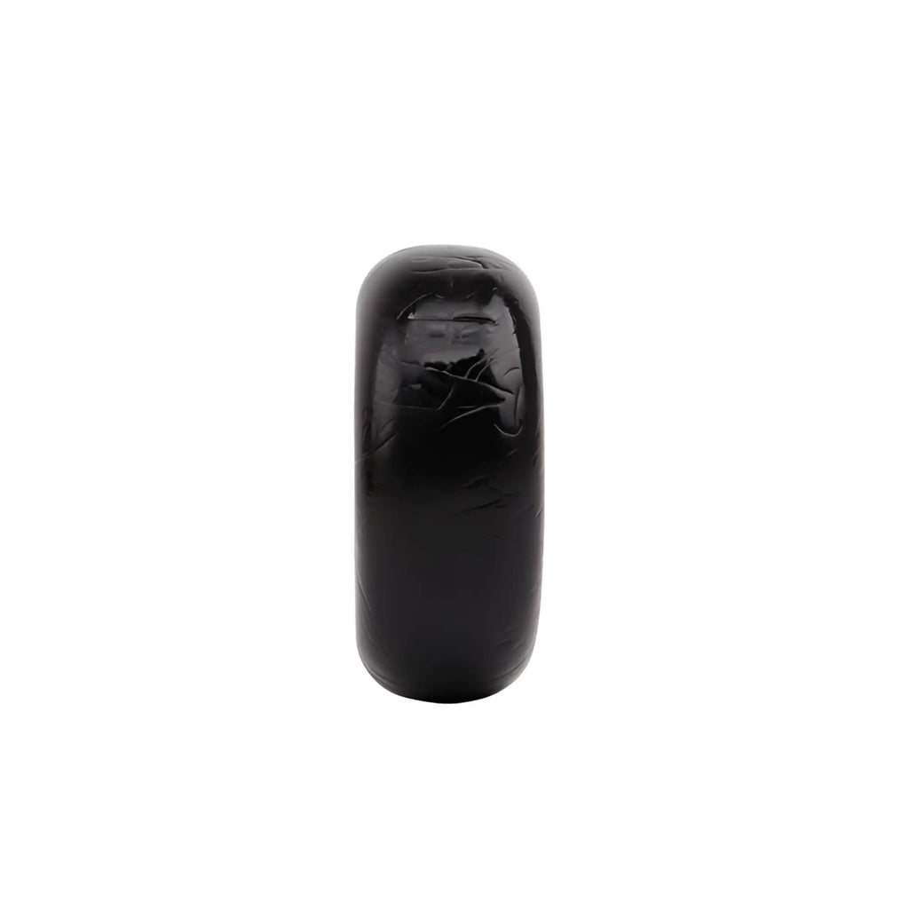 A sleek glossy black gk power mega fat o cock ring one size with smooth rounded band and subtle engraved detailing