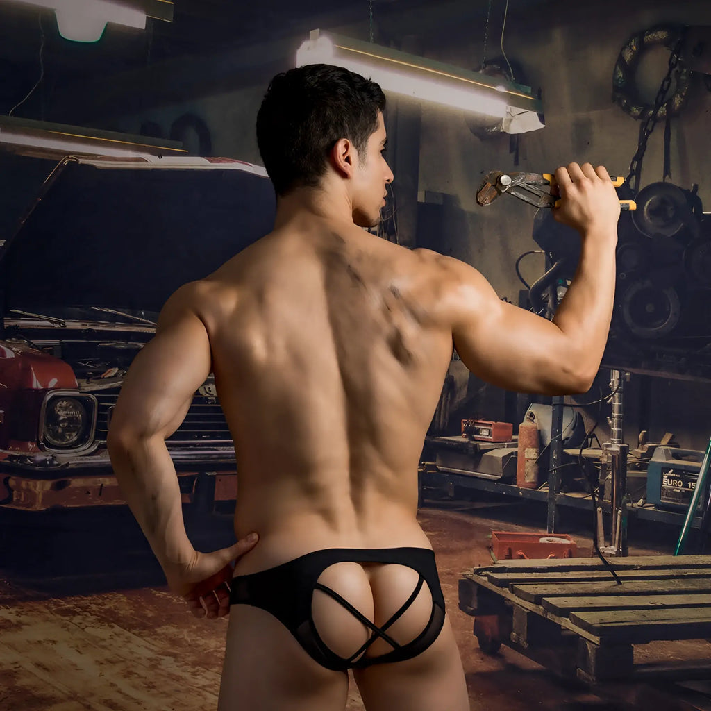 Black lace-trimmed good devil gde070 jockstrap briefs with a distinctive crisscross back design shown from the back