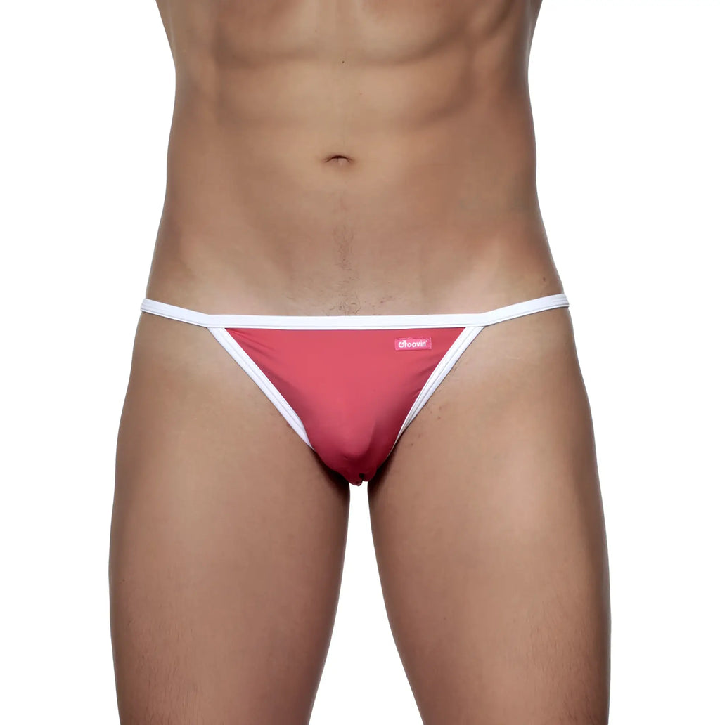 A vibrant pink groovin accent string bikini thong with white trim and a small brand tag rouge red st0415