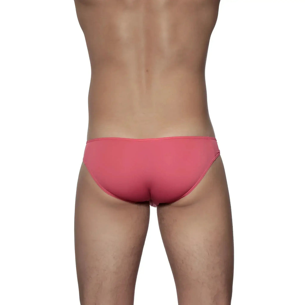 A sleek coral pink groovin underwear athletic v-cut bikini brief with smooth form-fitting fabric and minimalistic design