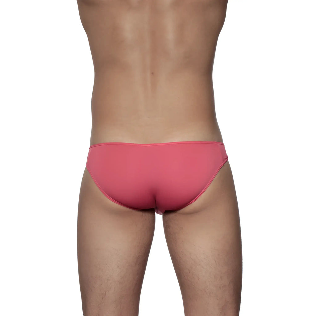 A sleek coral pink groovin underwear athletic v-cut bikini brief with smooth form-fitting fabric and minimalistic design