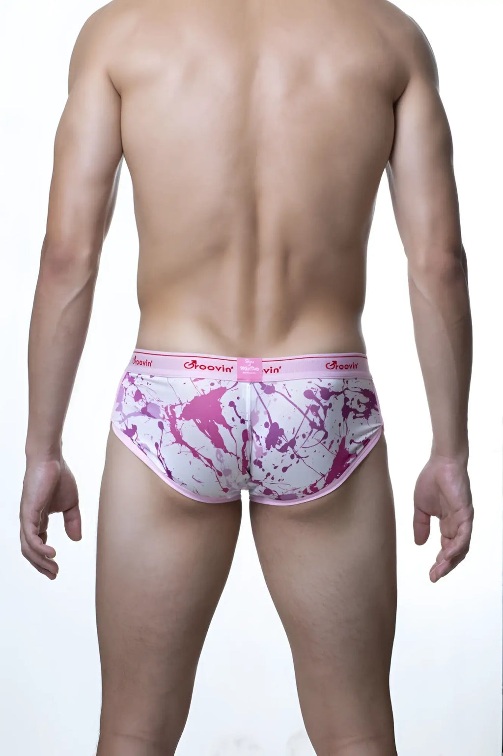 Pink and white splatter-patterned Groovin underwear cup boxer with matching pink waistband and brand name groovin