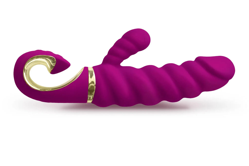 Purple silicone g-vibe g-candy raspberry toy with gold metallic accents and curved spiral design for personal use