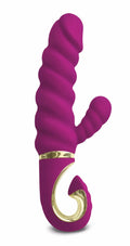Vibrant magenta gvibe gcandy raspberry silicone toy with gold-tone metallic accents and spiral design